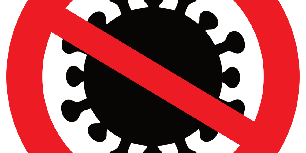 Ein symbolisches Verkehrsschild verbietet ein Virus