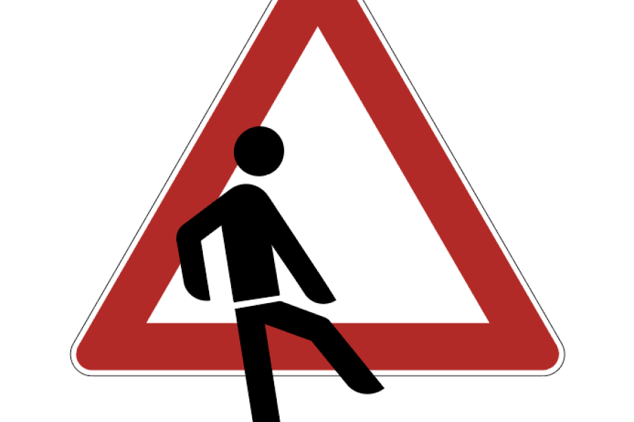 Das Symbol einer Person verlässt ein Warndreieck 